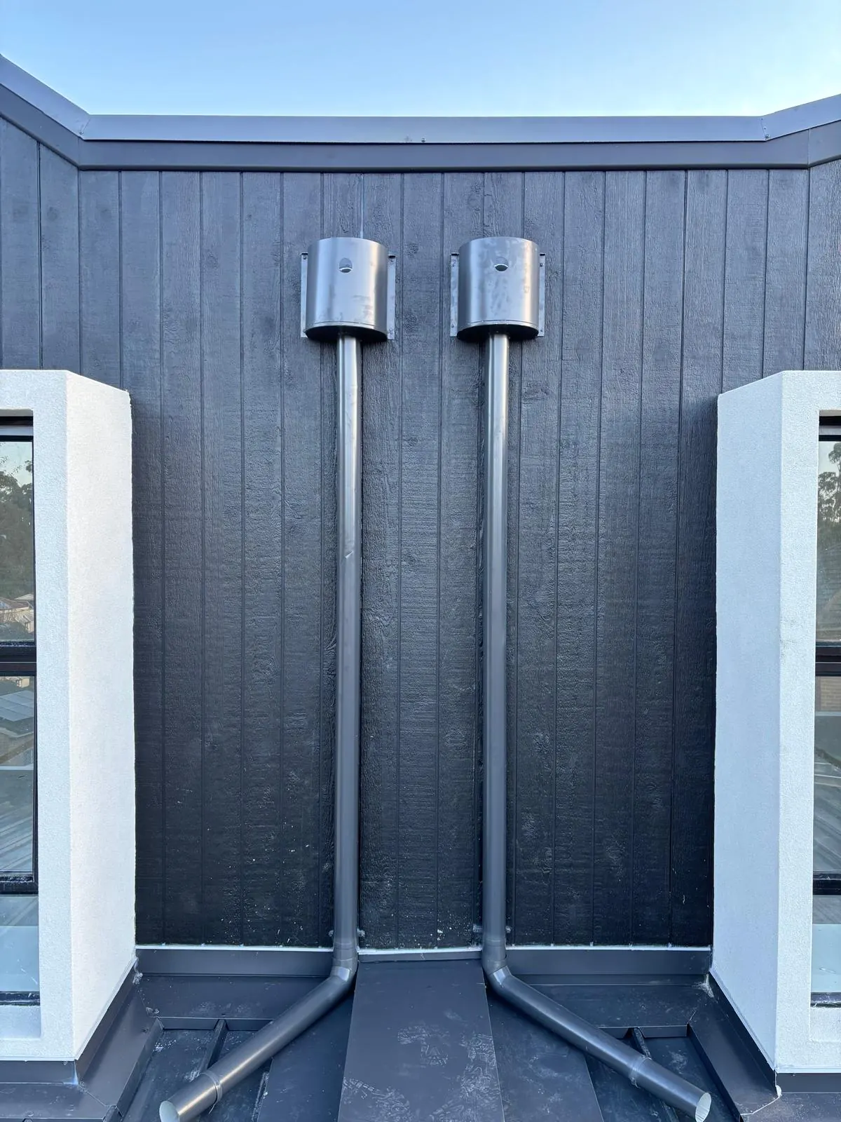 Dark vertical metal wall cladding