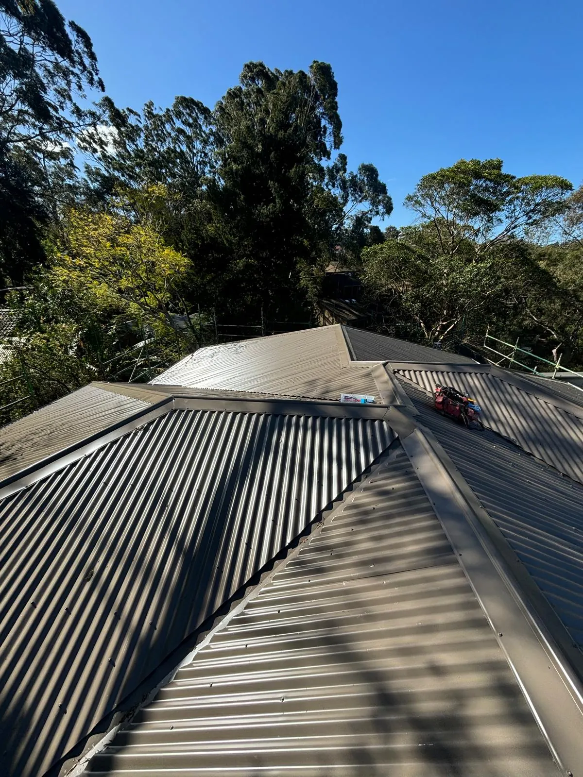 Residential metal roof valley and flashing work