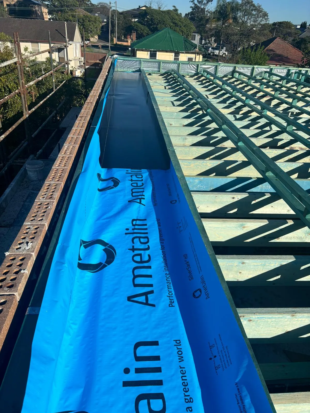 Roof sarking installed beneath a new metal roof